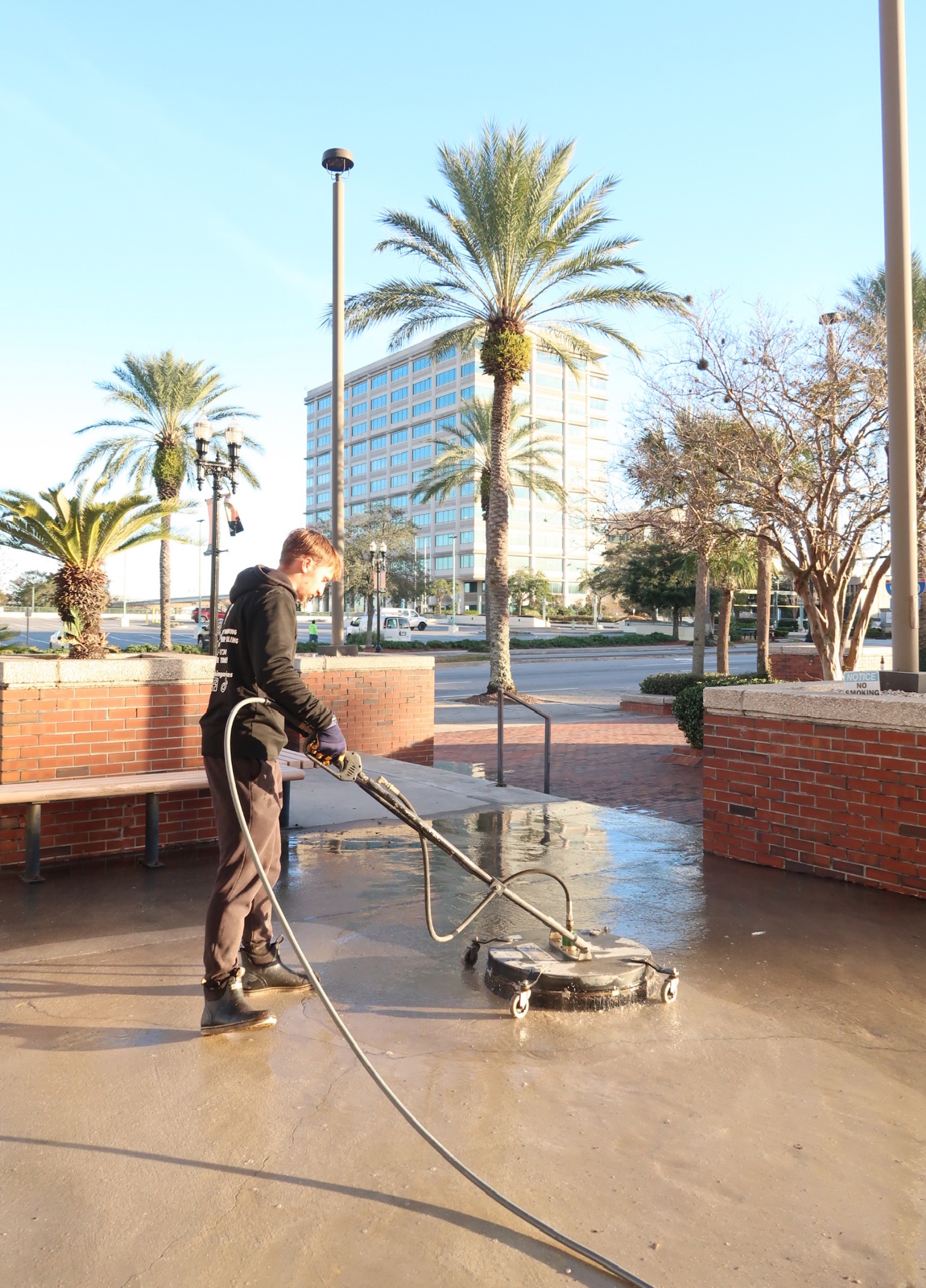 Pressure-Pro team cleaning a commercial plaza in Florida